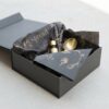Luxury Black Gift Wrapping Paper with Metallic Gold Brand Typography