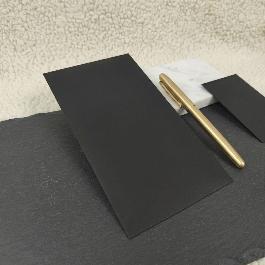 Minimalist black paper envelopes with wax seal matching Minimalist black paper envelopes with wax seal matching
