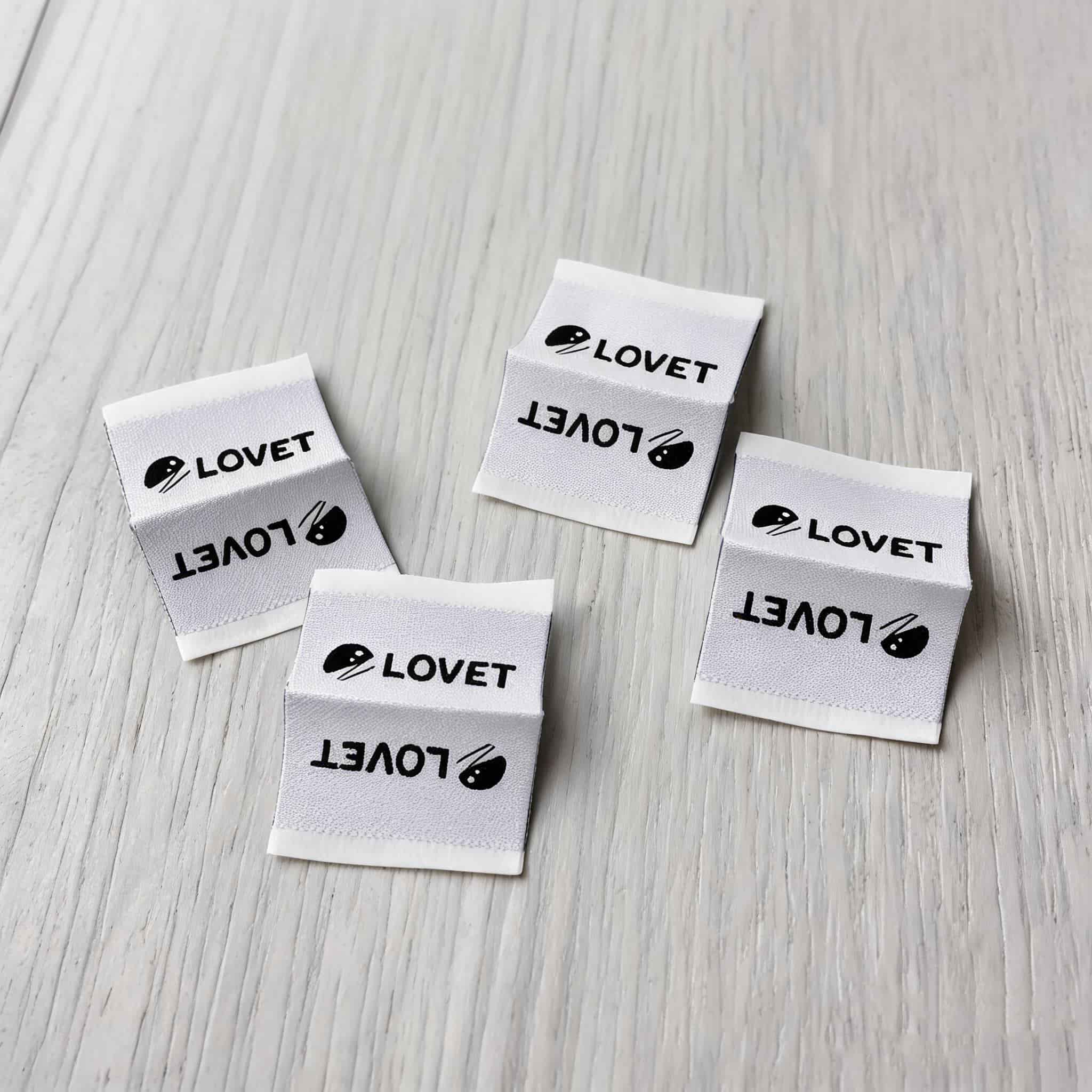 Wholesale double-sided apparel woven tags Wholesale double-sided apparel woven tags