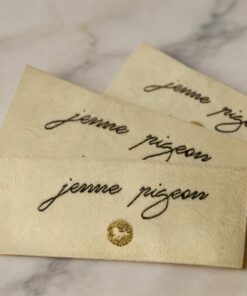 Custom beige center fold woven labels for shirts