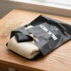 Black Die-Cut Handle Garment PE Plastic Packaging Bag Factory Direct